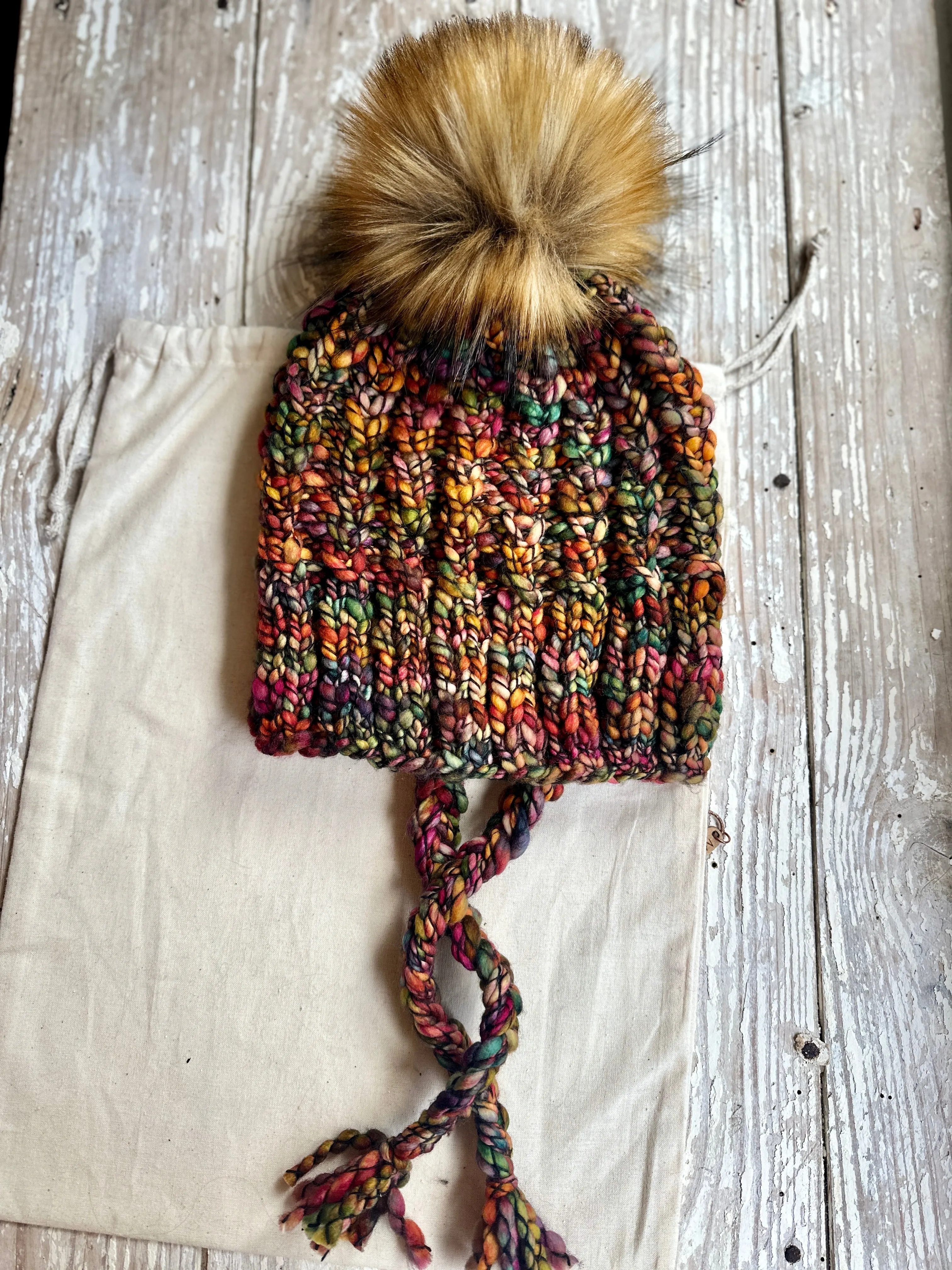 Merino wool split brim knit hat with faux fur pom